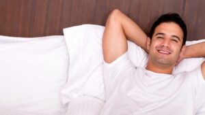 A man relaxes in bed