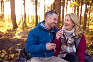 Two people sitting on a bench in the woods, Enhance Your Well-Being with Bioidentical Hormone Therapy