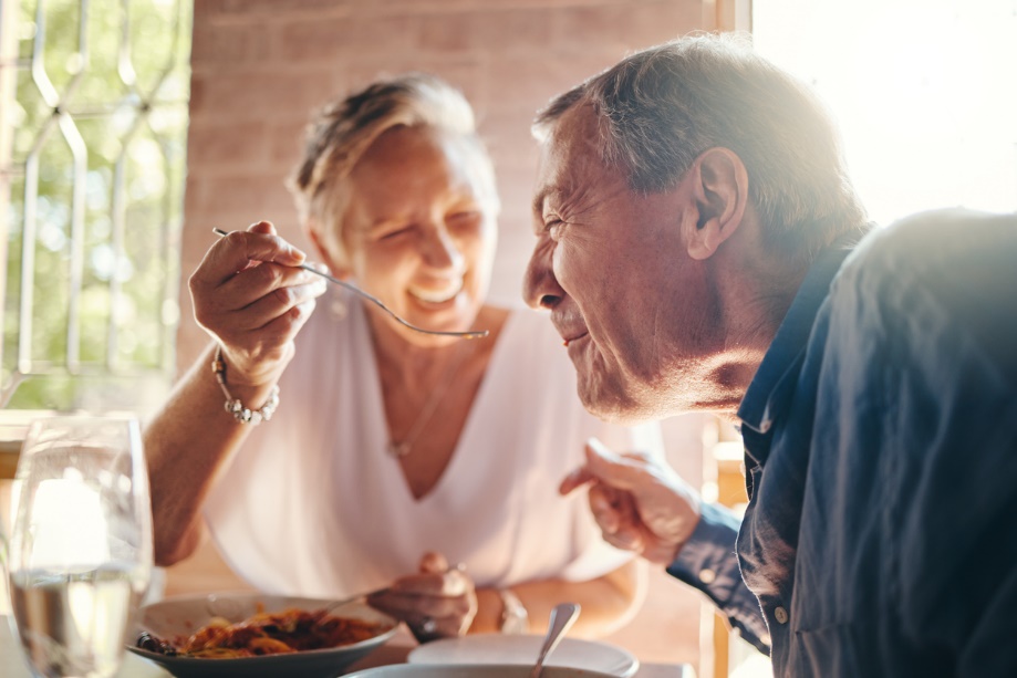 two people eating and being very happy