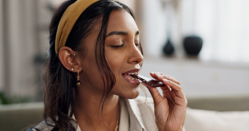 A person eating chocolate
