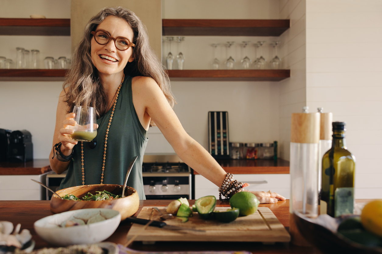 Healthy older woman preparing a nutritious meal